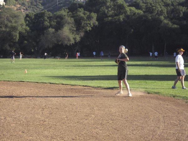 Justine throws from second